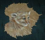 Acrylic painting of cougar kitten done on a grapevine leaf